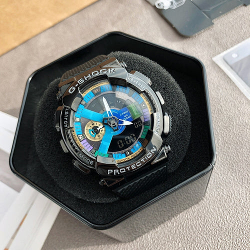 Casio watch with black strap and metal bezel, blue multi-dial face inside a dark display box