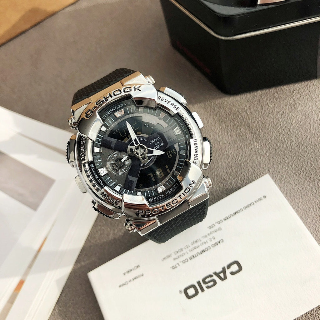 Casio watch with black strap and silver bezel, gray multi-dial face with sub-dials