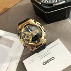 Casio watch with gold bezel and black strap, gold multi-dial face with blue accents