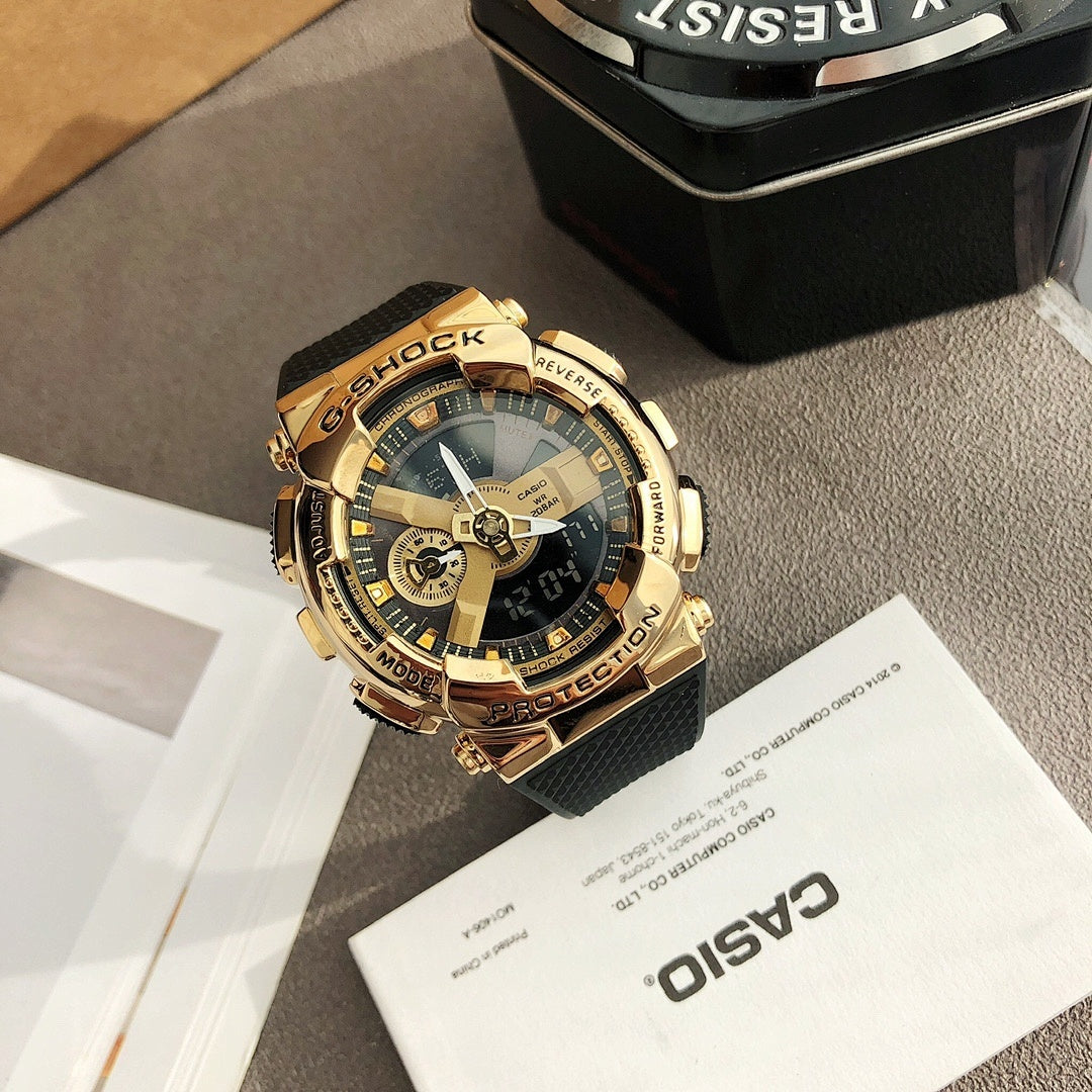 Casio watch with gold bezel and black strap, gold multi-dial face with blue accents