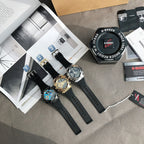 Casio watches with black straps, silver-blue and gold faces arranged on a surface