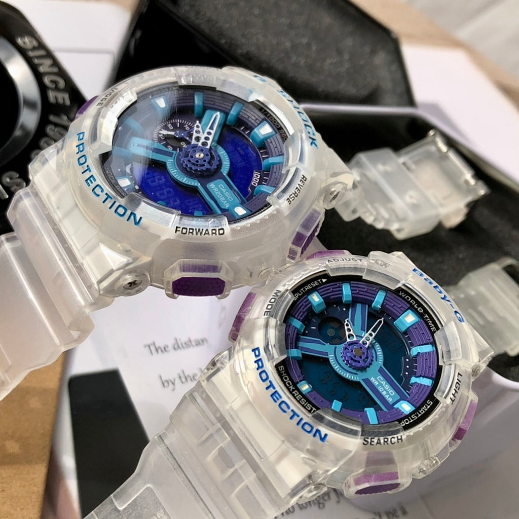 Casio G-Shock watch with clear case, blue dial, purple strap accents