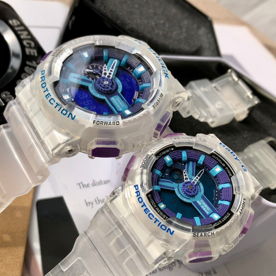 Casio G-Shock watch with clear case, blue dial, purple strap accents