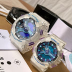 Casio G-Shock and Baby-G watches with clear cases, blue dials, purple bezels