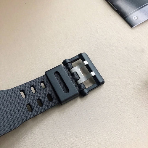 Black rubber watch strap with buckle clasp and metal keeper