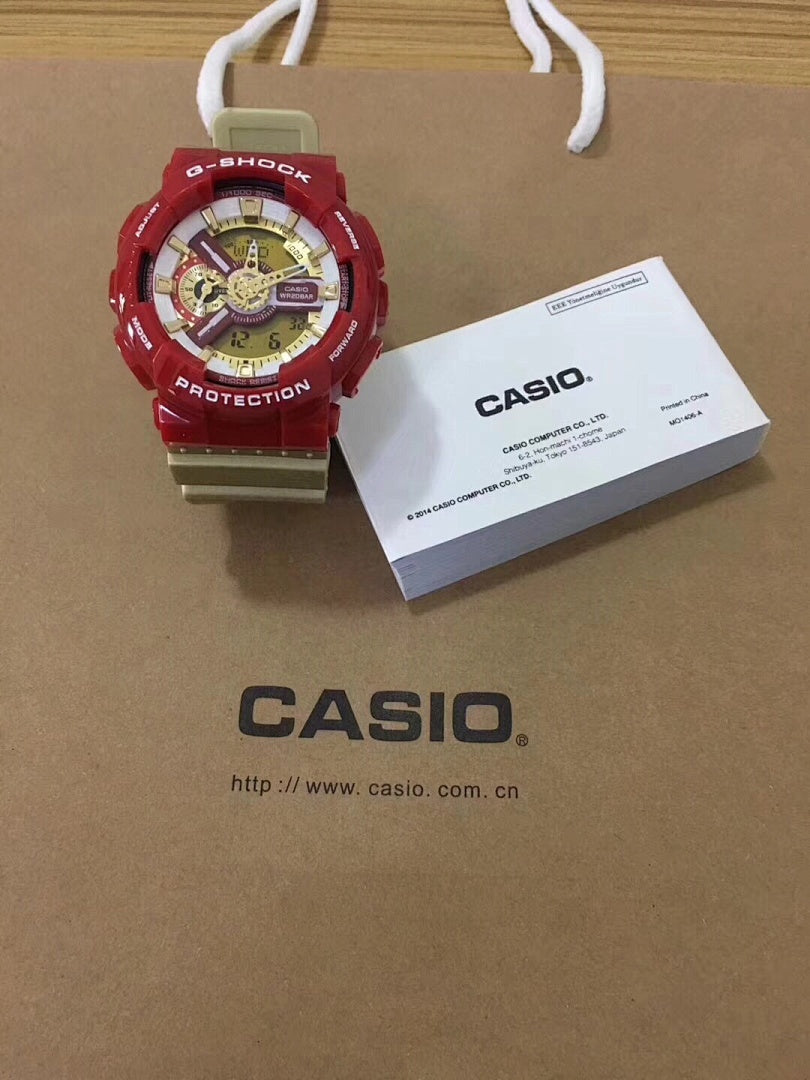 G-Shock watch with red resin strap and gold dial, multiple subdials.