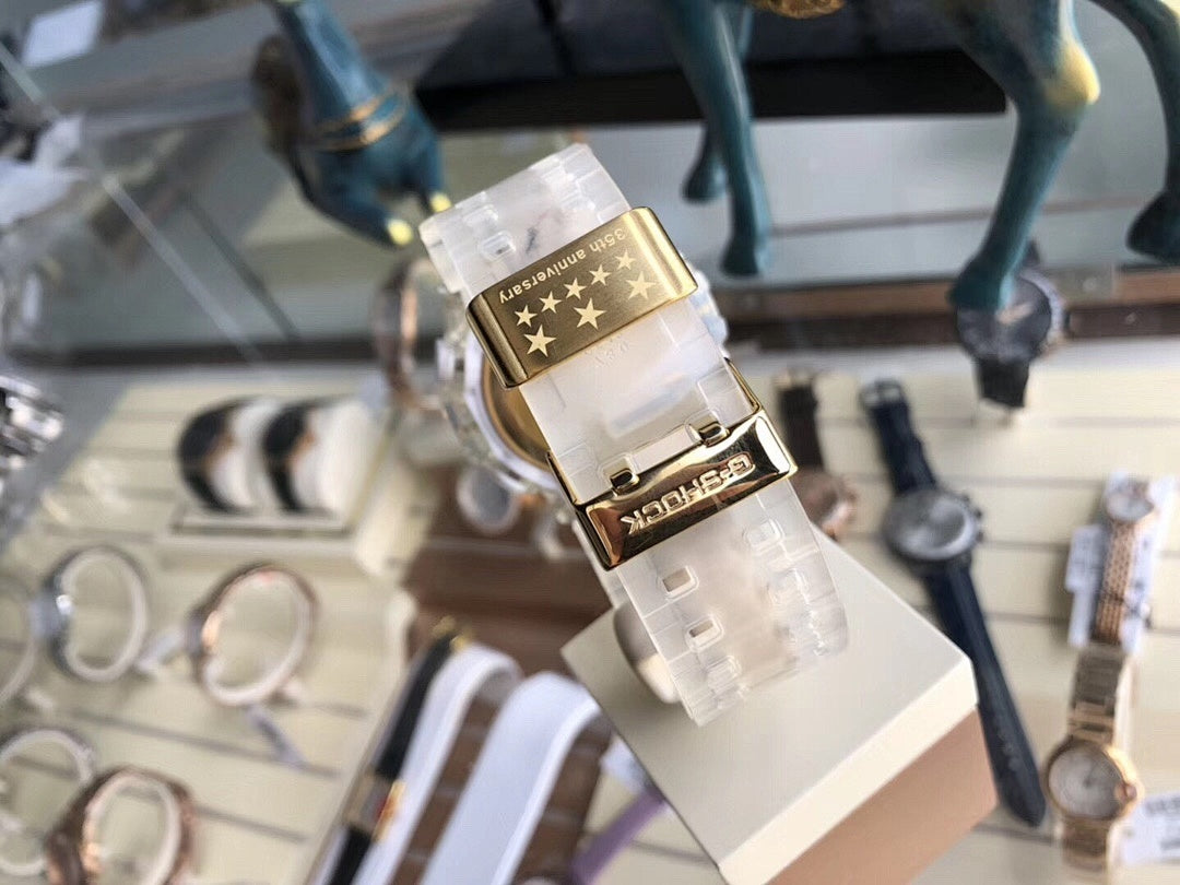 Casio watch with white translucent strap and gold star-pattern bezel plate