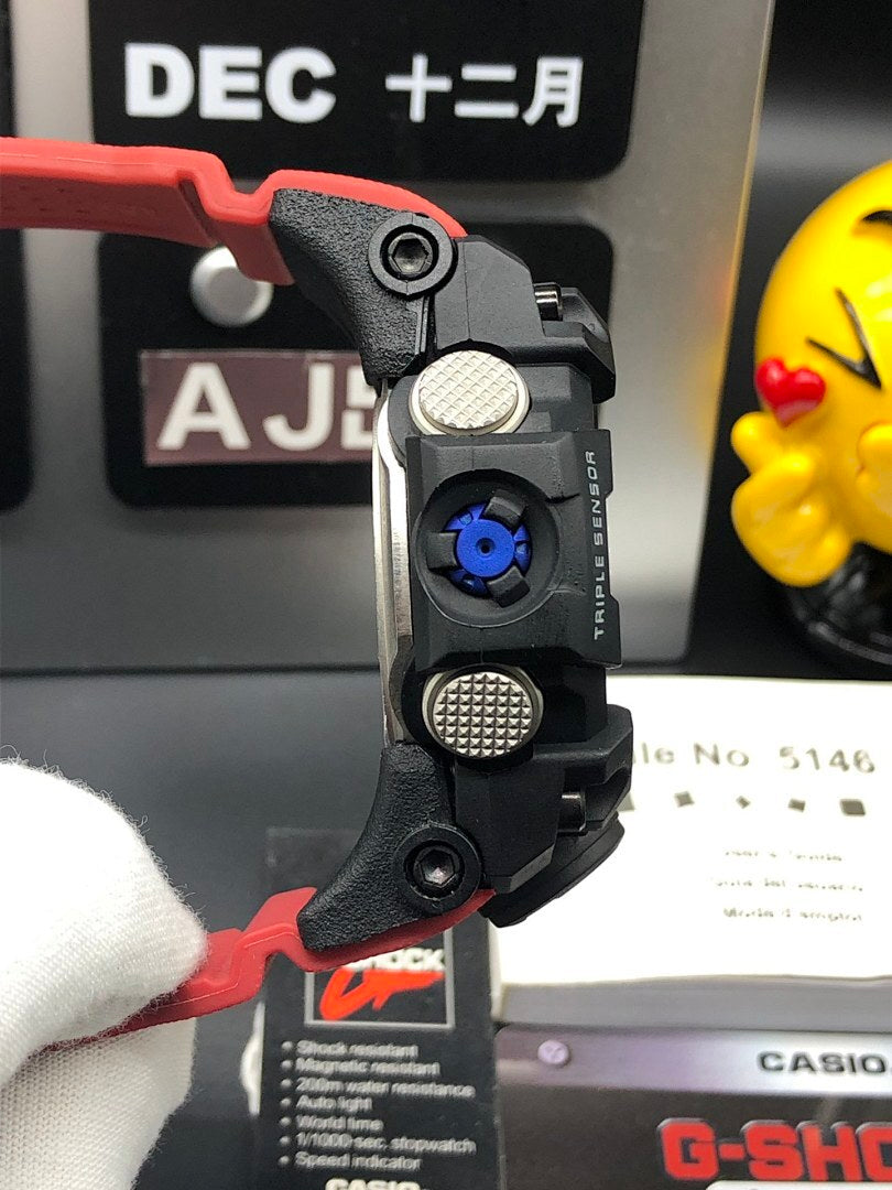 Casio G-Shock wristwatch side profile with black case and red strap