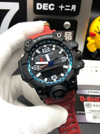 Casio G-Shock wristwatch front view with blue-highlight bezel and red rubber strap