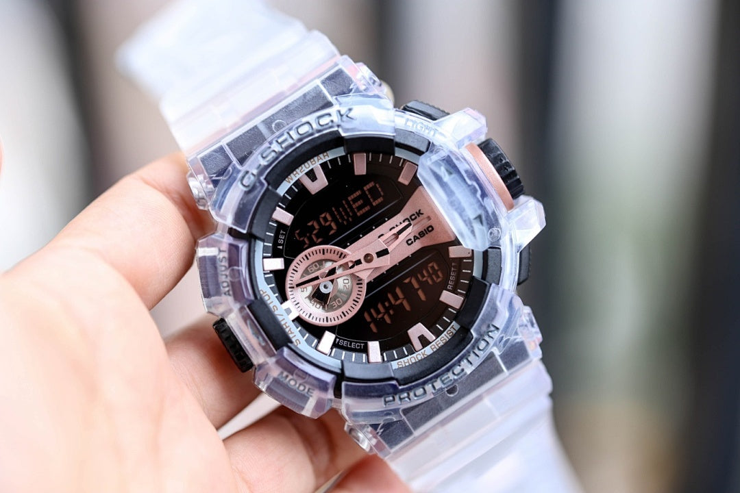 Casio G-Shock watch with translucent case, dark dial with rose-gold accents and subdials