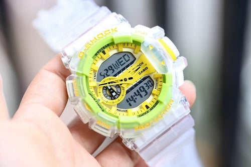 Casio G-Shock watch with translucent white strap and neon green bezel, gold digital face