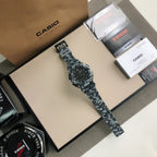 G-Shock camo sport watch lying flat, black dial and gray camo resin strap