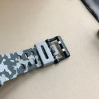 G-Shock camo watch strap with gray buckle clasp and perforated resin band