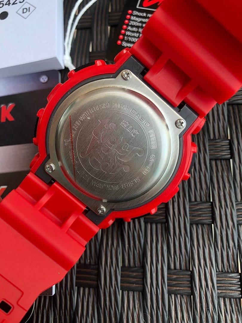 Casio G-Shock case back close-up with engraved text on red strap