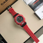 Red G-Shock wristwatch with perforated strap and black bezel accents.
