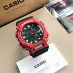 Red and black G-Shock wristwatch with digital face and black strap insert.