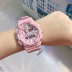 Casio G-Shock watch with pink resin strap and round analog-digital face