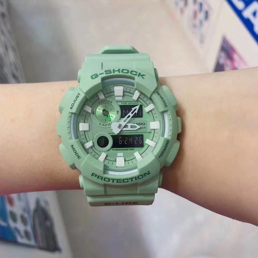 Casio G-Shock watch with mint green resin strap and round analog-digital face