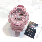Casio G-Shock watch with pink resin strap and round analog-digital face
