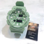 Casio G-Shock watch with green resin strap and round analog-digital face