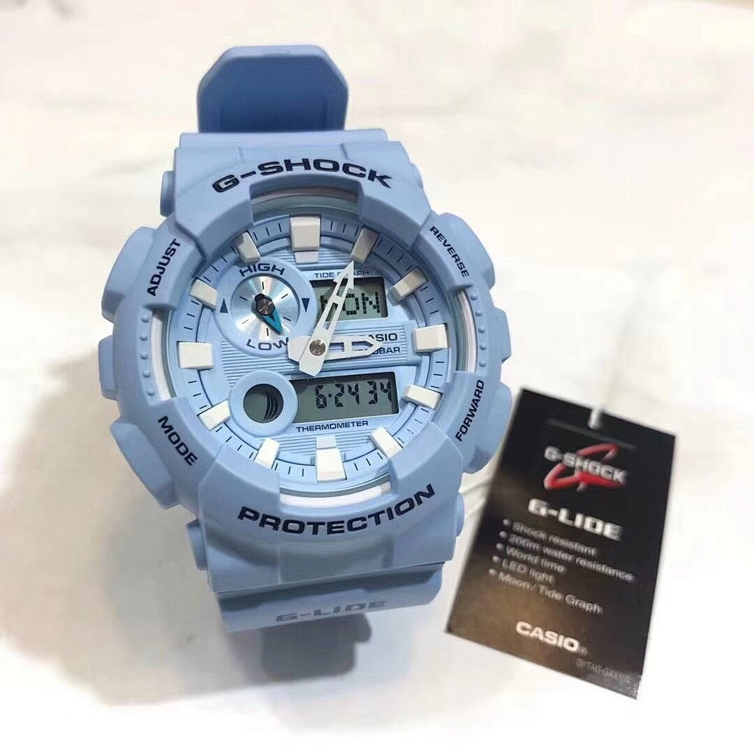 Casio G-Shock watch with blue resin strap and round analog-digital face