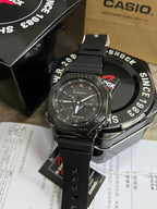 Casio G-Shock watch with black case, black strap, dark dial with gold indexes