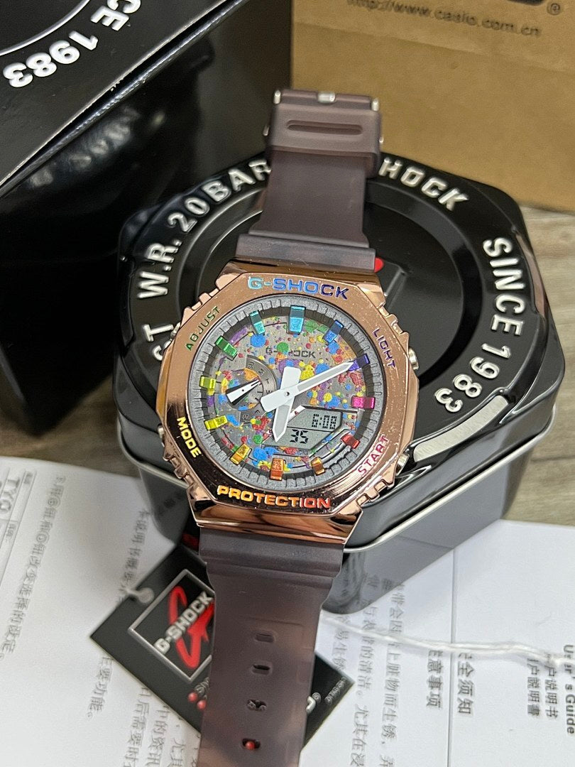Casio G-Shock watch with rose-gold bezel, mauve strap, colorful dial with subdials