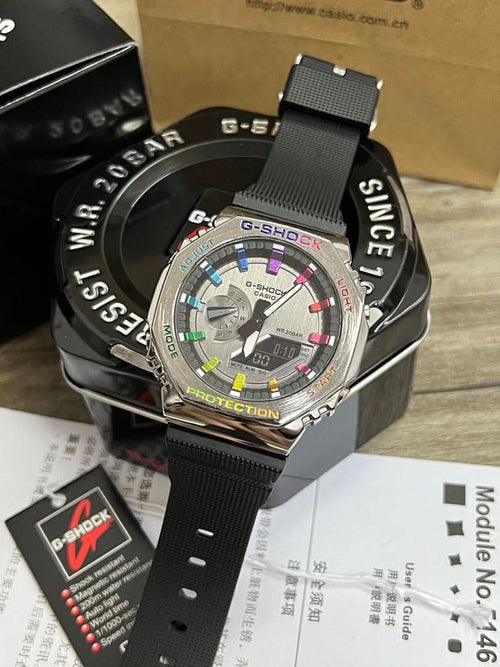 Casio G-Shock watch with silver case, black strap, multicolor dial and red accents