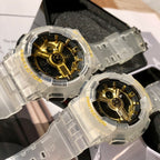 Casio watch pair with clear straps and gold skeleton dials in display boxes