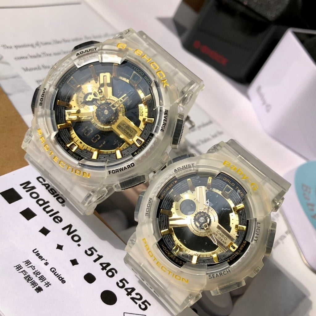 Casio watch pair with clear resin straps and gold skeleton dials, angled front view
