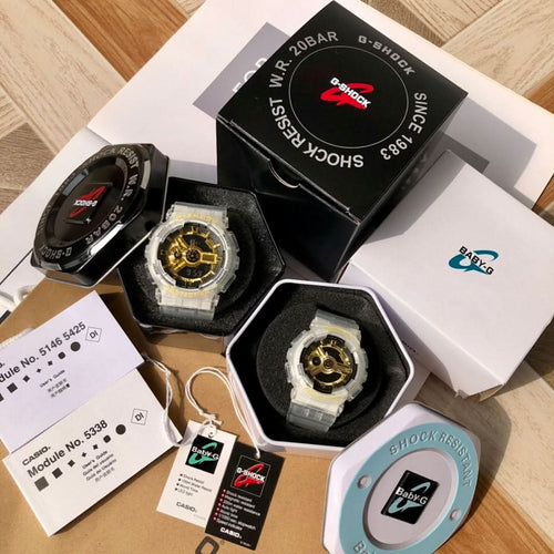 Casio watch set with clear resin straps and gold skeleton dials beside a black watch