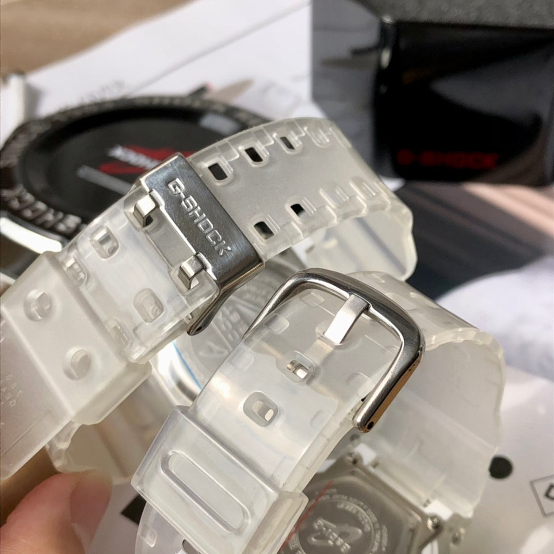 Casio watch clasp with silver buckle and clear resin strap close-up