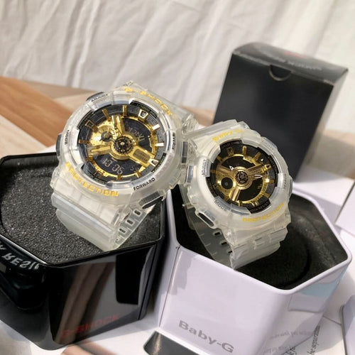 Casio watch pair with clear resin straps and gold skeleton dials