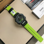 Casio G-Shock watch with neon green strap and black bezel, side view