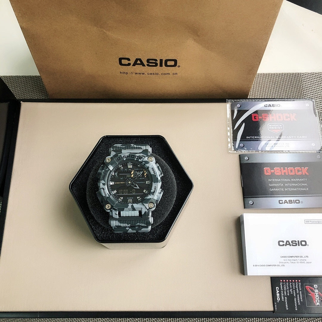 Casio G-Shock watch on a black cushion with black dial and camo band