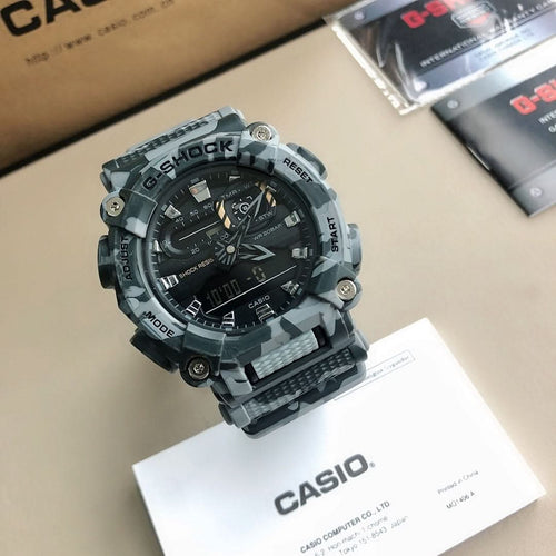 Casio G-Shock watch with black and gray camo band and black digital face