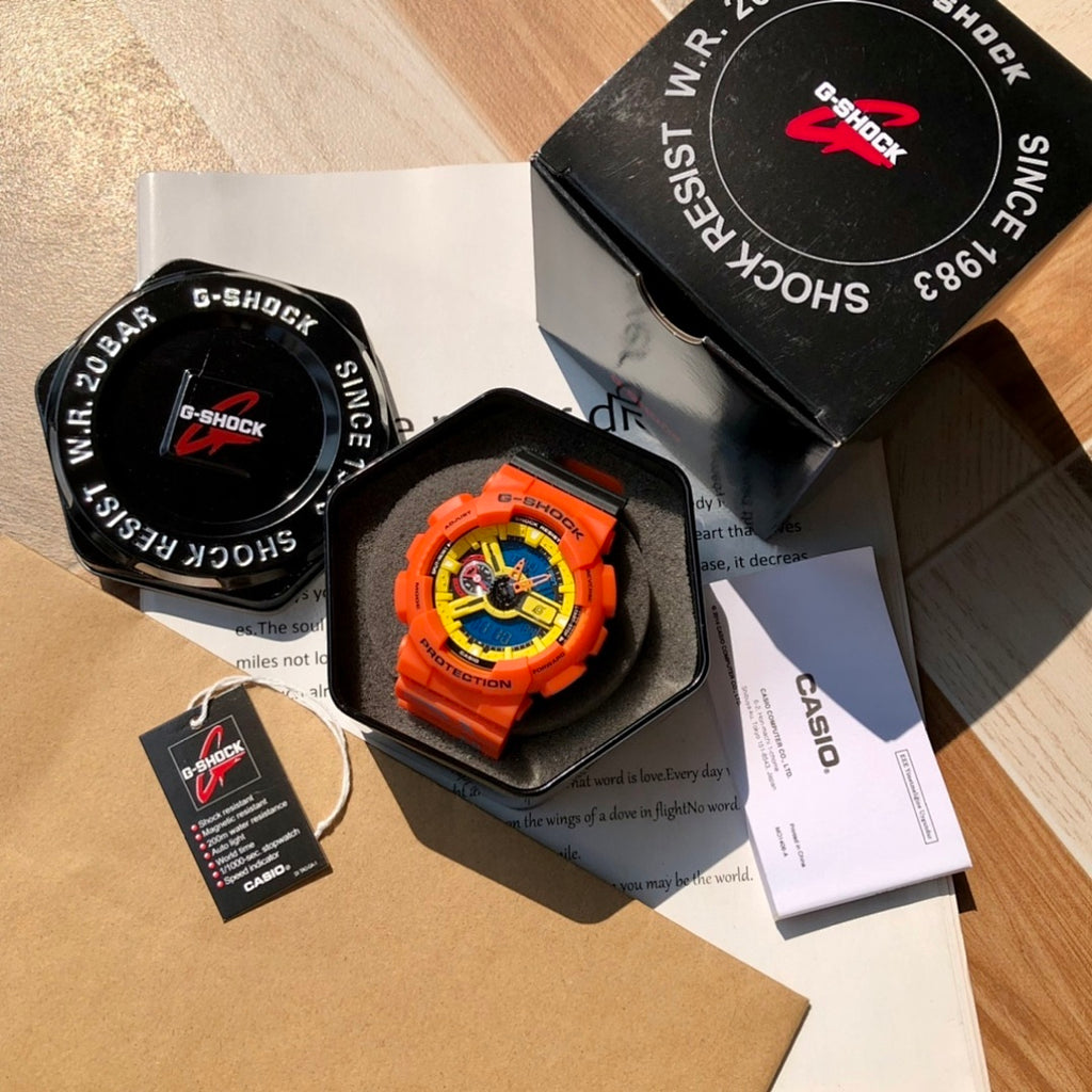 Casio G-Shock watch set in box with orange strap, tag, and paperwork