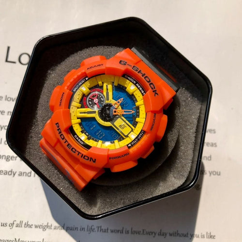 Casio G-Shock watch with orange resin case and strap, blue dial and gold accents