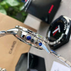 Casio watch side with chrome case, buttons, and blue crown accents