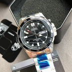Casio watch with black dial, day/date window, silver bezel, blue strap accents