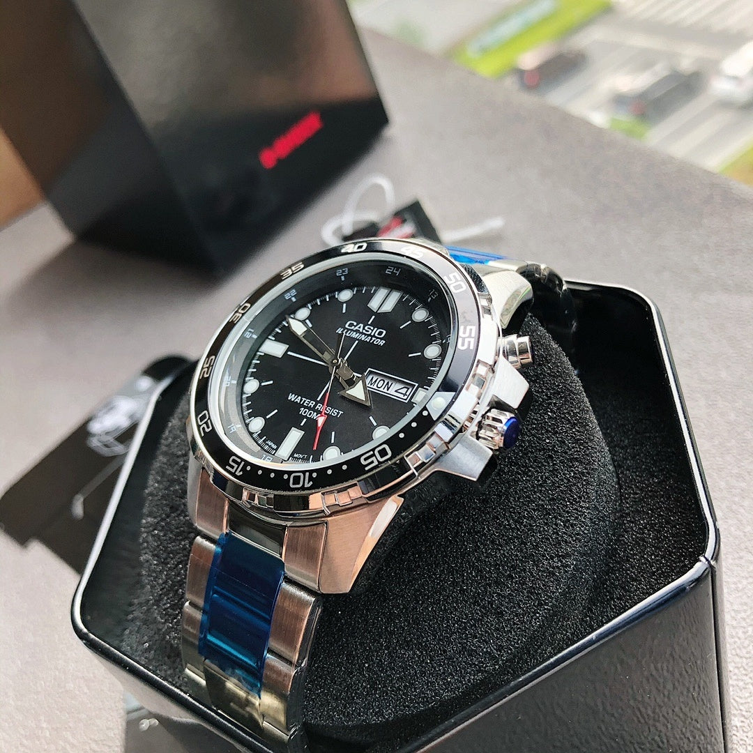 Casio watch with black dial, silver case, and blue strap links, in black box