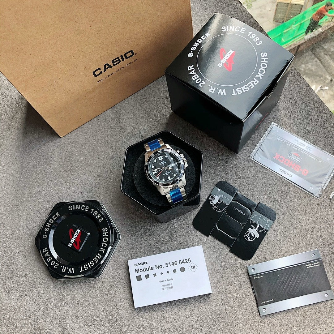Casio watch in box with black cushion, silver bracelet, blue accents, and card documents