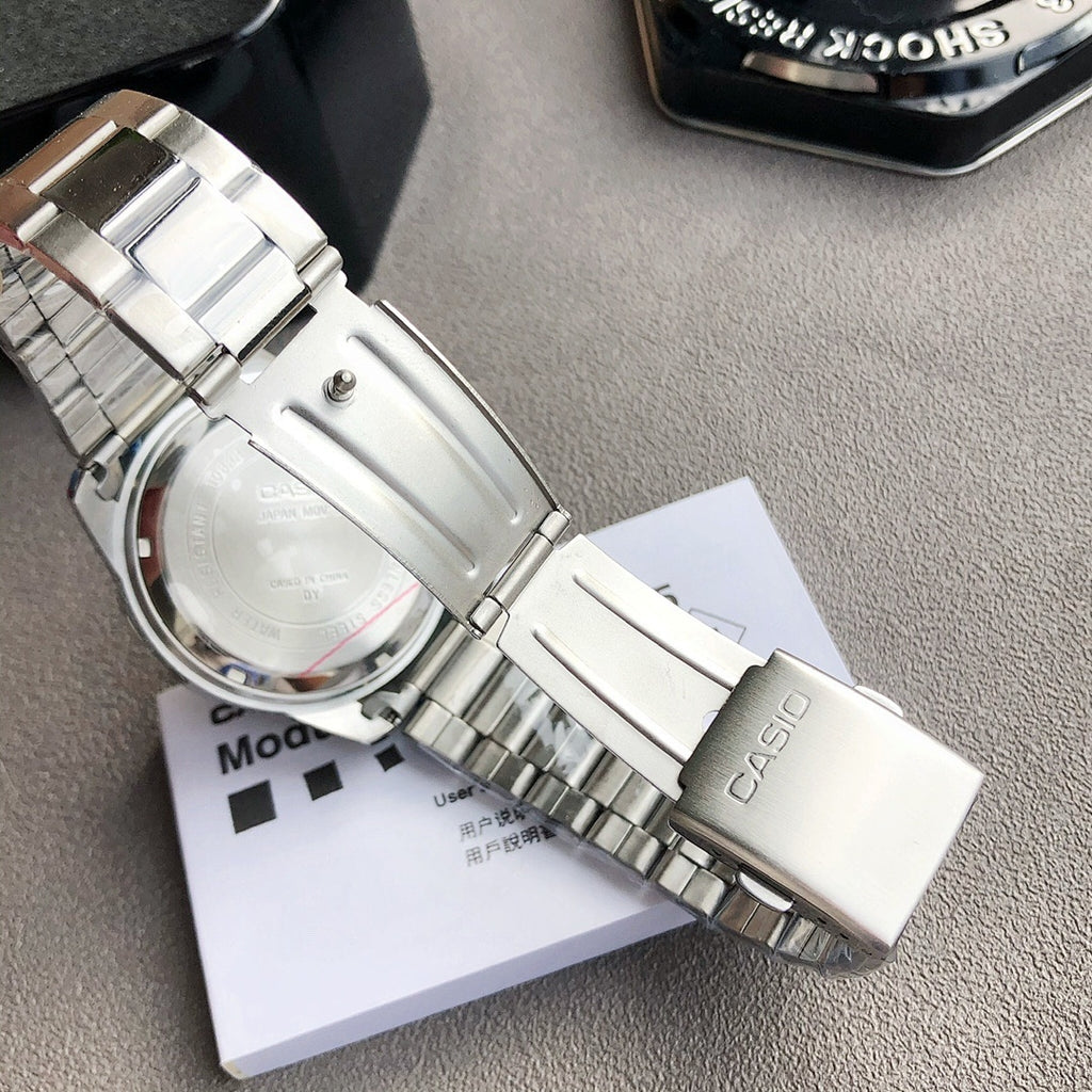 Casio watch back with silver metal case and bracelet, showing engraved text