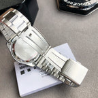 Casio watch back with silver metal case and bracelet, showing engraved text