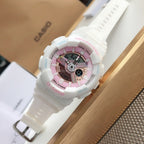 White Casio wristwatch with pink dial and digital display window, white resin strap