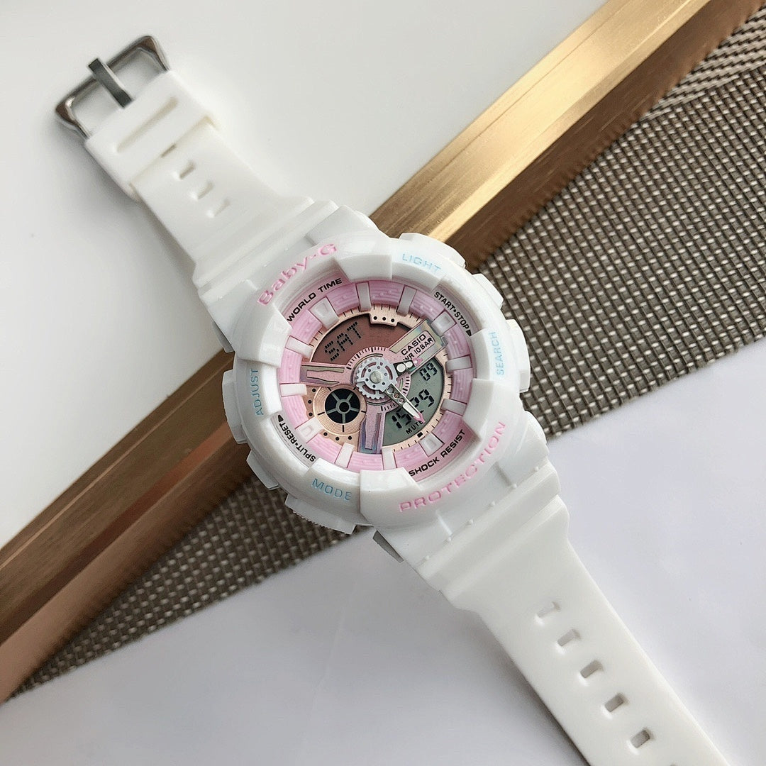 White Casio watch with pink dial and white resin strap, angled view with clasp