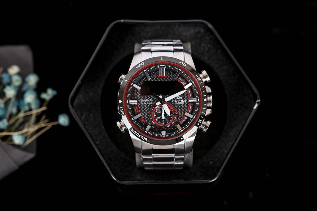 Stainless steel chronograph watch, black dial with red accents, in display box