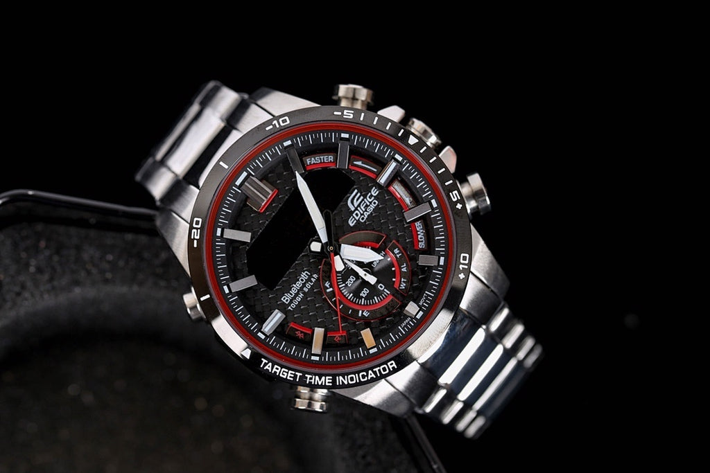 Stainless steel chronograph watch with black dial and red subdials, metal bracelet