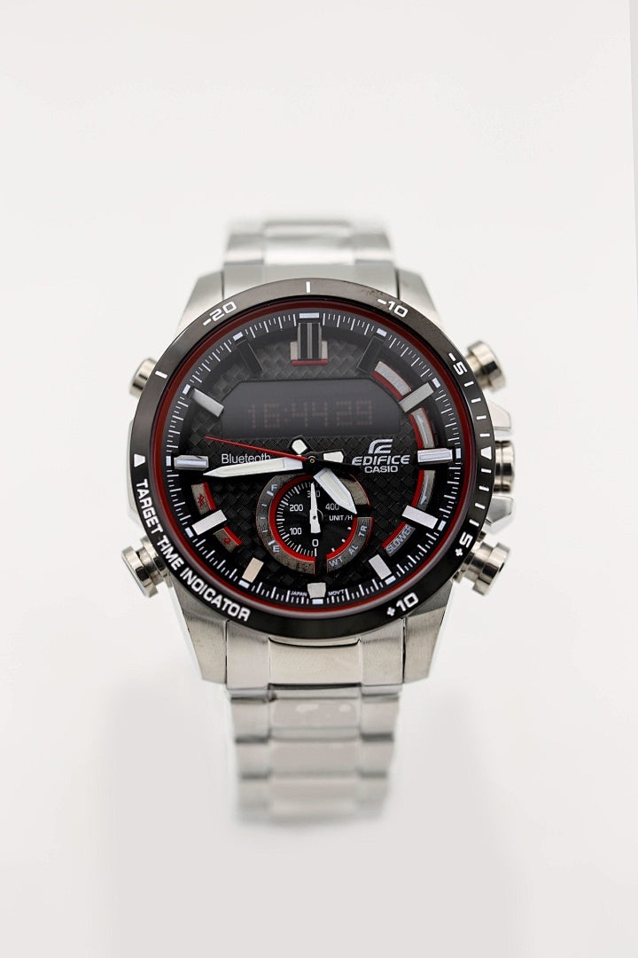 Stainless steel chronograph watch with black dial, red ring details, metal bracelet