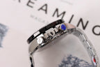 Stainless steel watch side with crown and pushers, black bezel accents